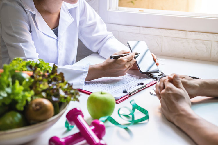 nutritionist showing app to patient