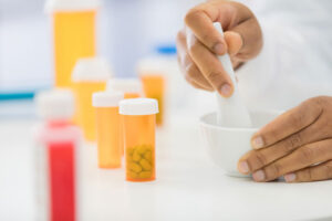 pharmacist making compound prescription