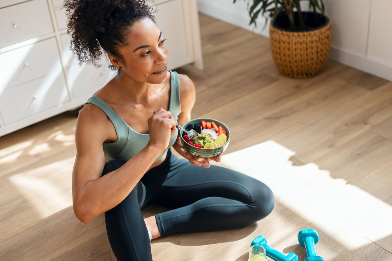 woman eating healthy after working out