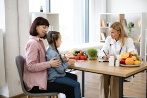 Nutritionist reviewing salary and career growth information with client in professional office setting