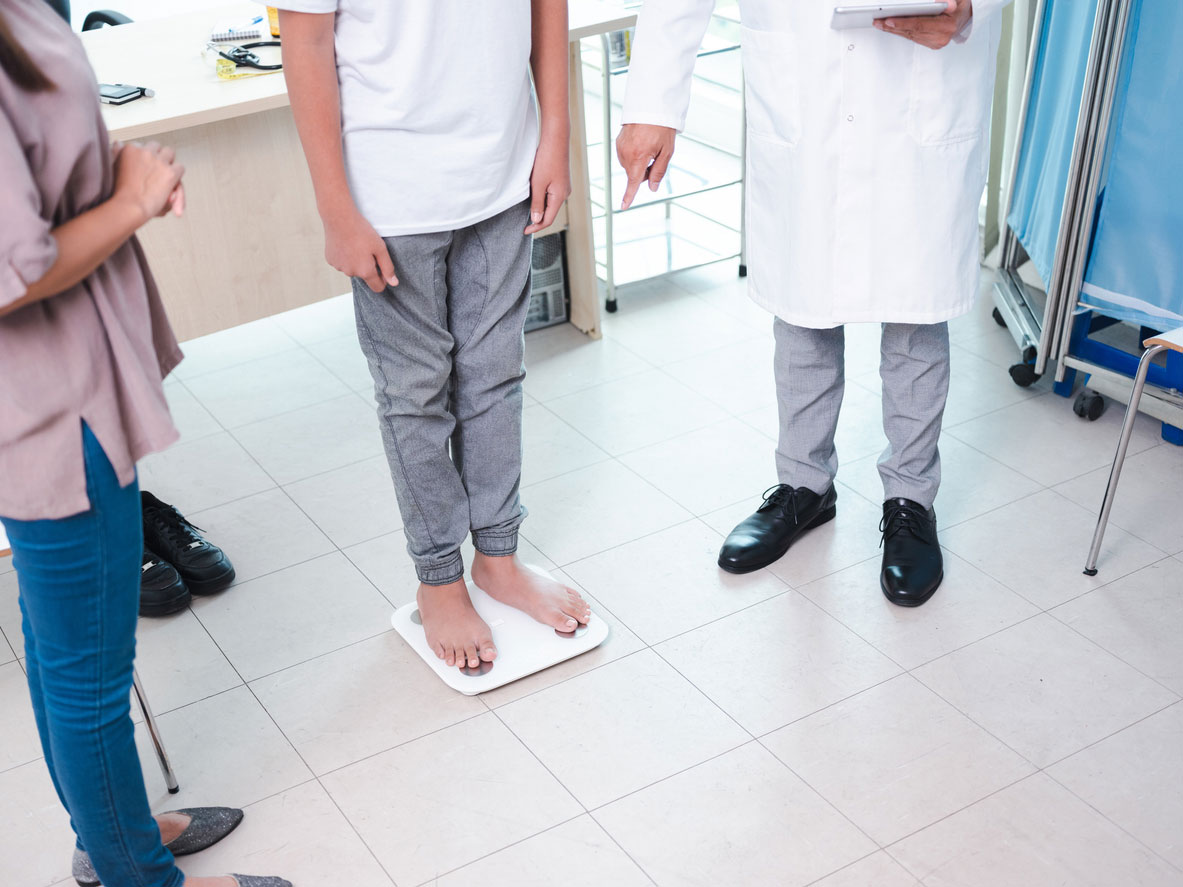 teen on weight scale