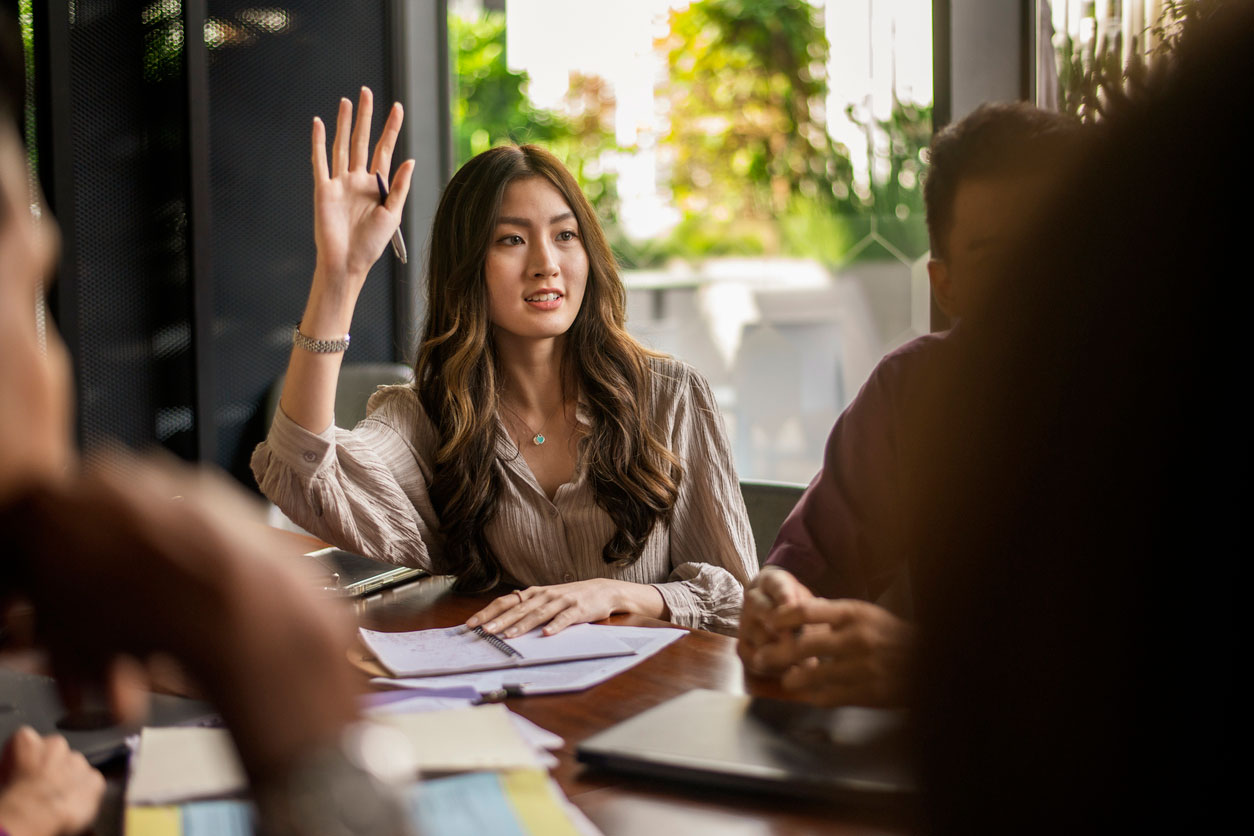 woman asking questions in small group