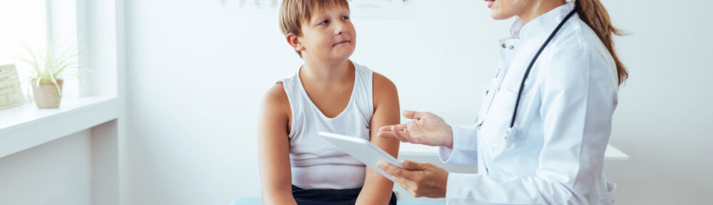 young boy getting a check-up with nutritionist
