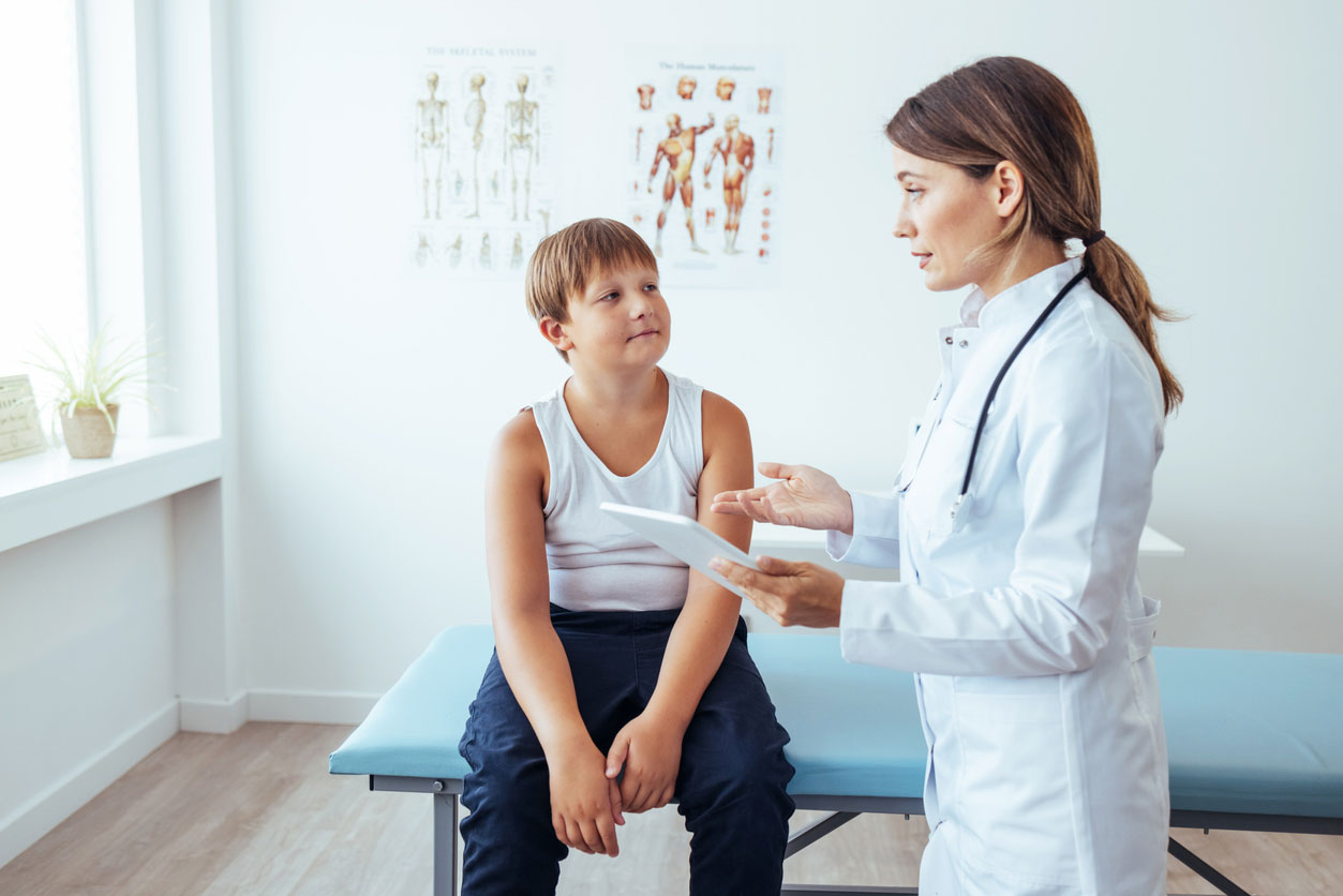 young boy getting a check-up with nutritionist